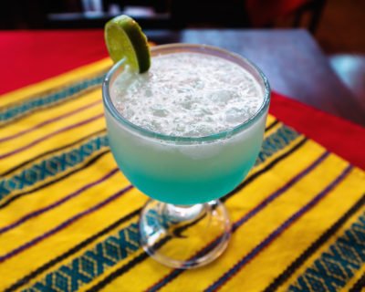 Blue Splash margarita Tequila Blue Curacao Lemon Lime Soda in Margarita glass